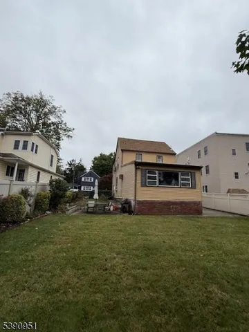 a view of a big yard with houses