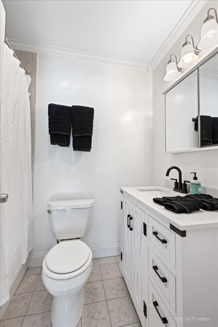 116 Deerpath Road Lake In The Hills, IL 60156 - Photo 18 of 33 a bathroom with a toilet a sink and a mirror