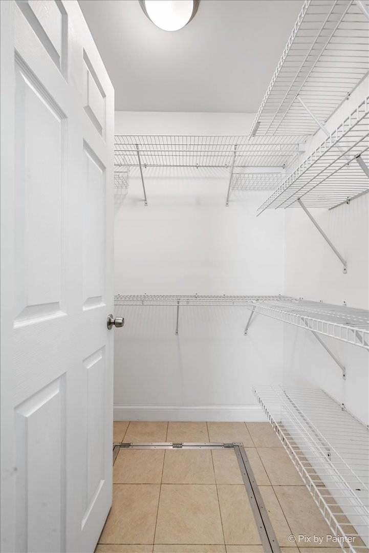 116 Deerpath Road Lake In The Hills, IL 60156 - Photo 19 of 33 a view of a room with racks on the wall