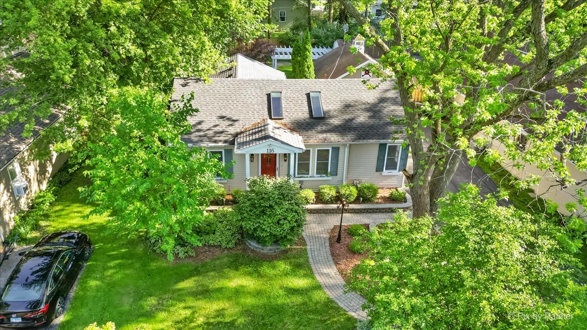 116 Deerpath Road Lake In The Hills, IL 60156 - Photo 22 of 33 a front view of a house with garden