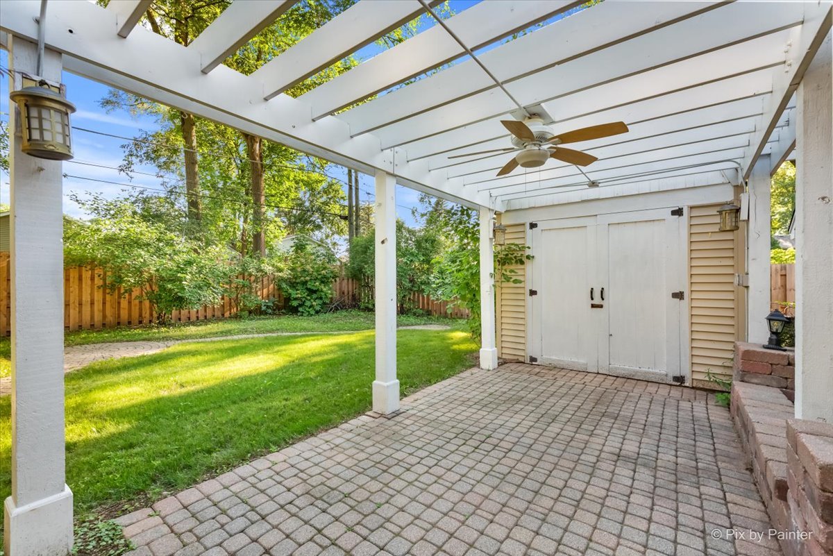 116 Deerpath Road Lake In The Hills, IL 60156 - Photo 28 of 33 a porch with a table and chairs in patio with wooden fence