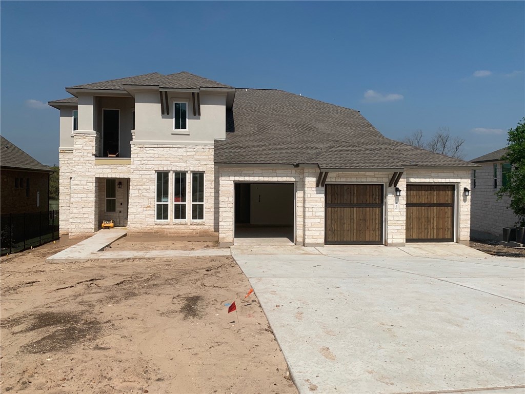 330 Cistern Way Austin, TX 78737 - Photo 1 of 1 a front view of a house with yard