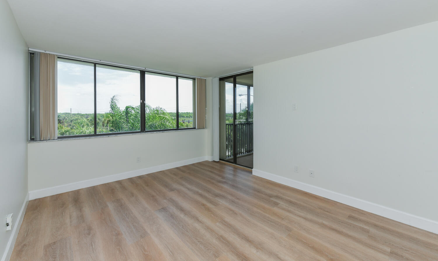 1605 Highway 1, Unit M1403 Jupiter, FL 33477 - Photo 16 of 34 wooden floor in an empty room with a window