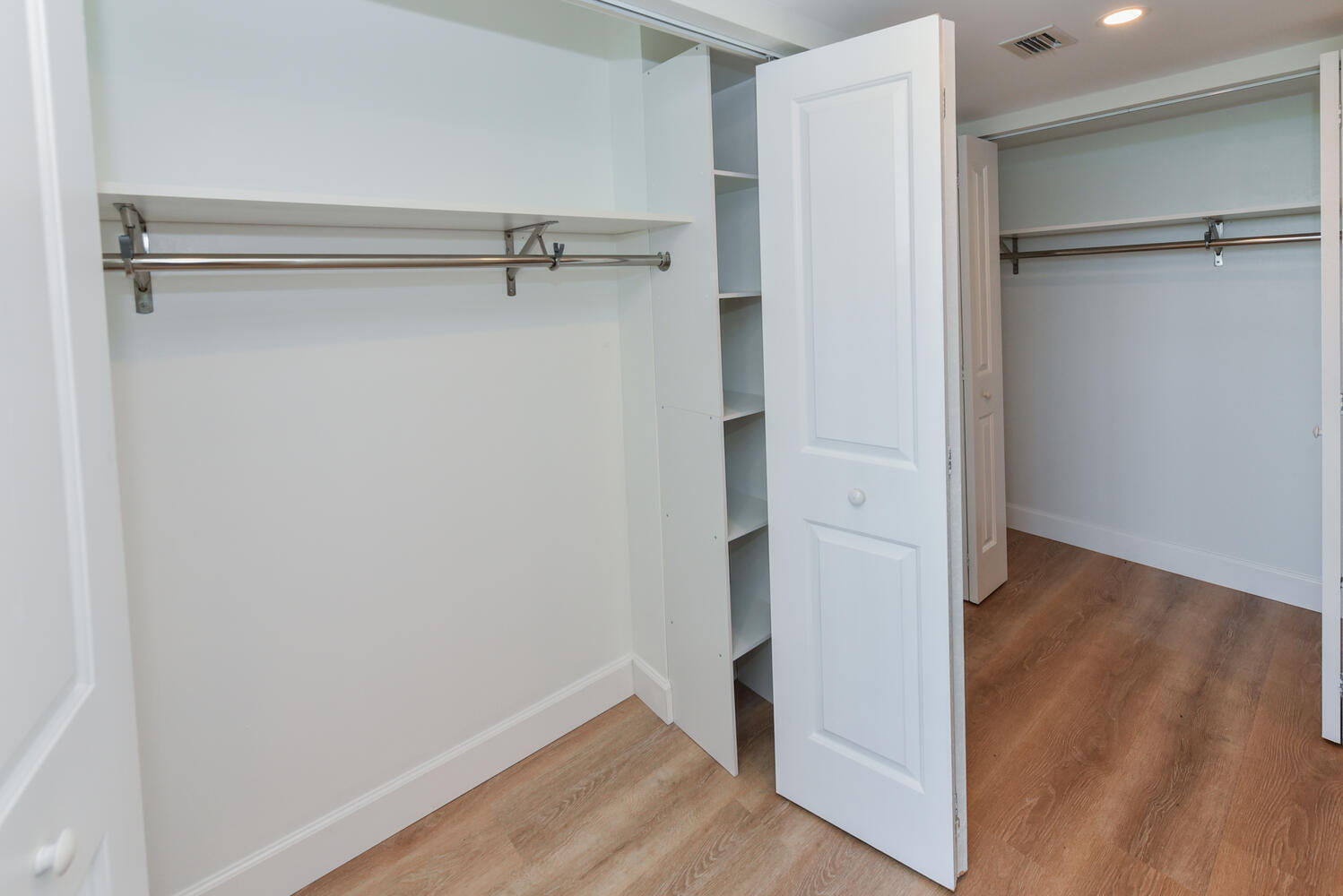 1605 Highway 1, Unit M1403 Jupiter, FL 33477 - Photo 18 of 34 a view of walk in closet with empty racks