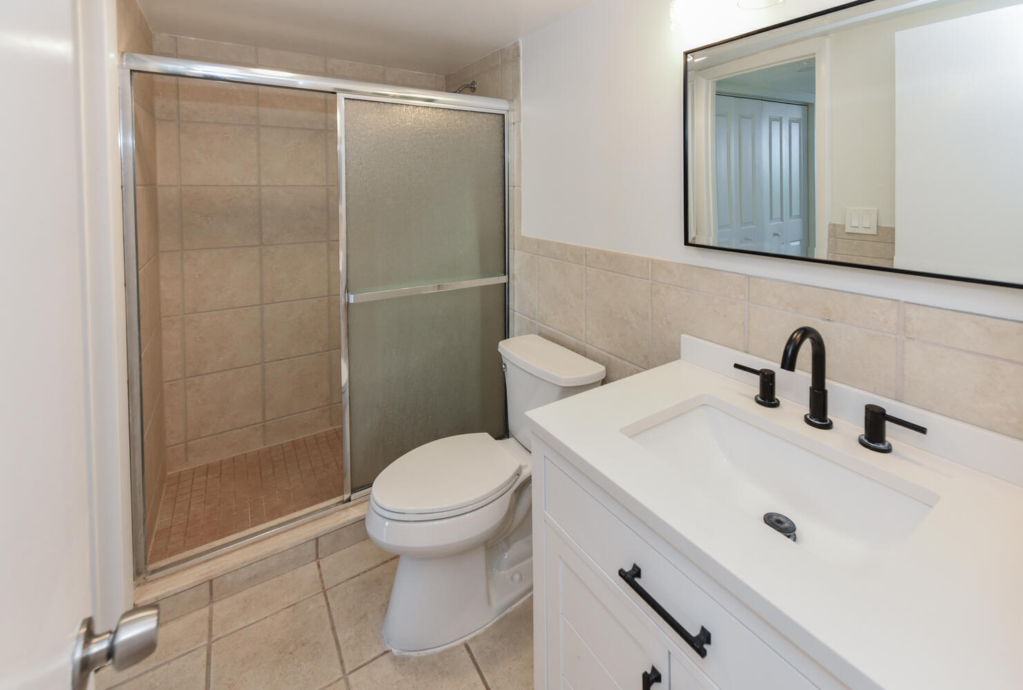 1605 Highway 1, Unit M1403 Jupiter, FL 33477 - Photo 23 of 34 a bathroom with a sink toilet and shower
