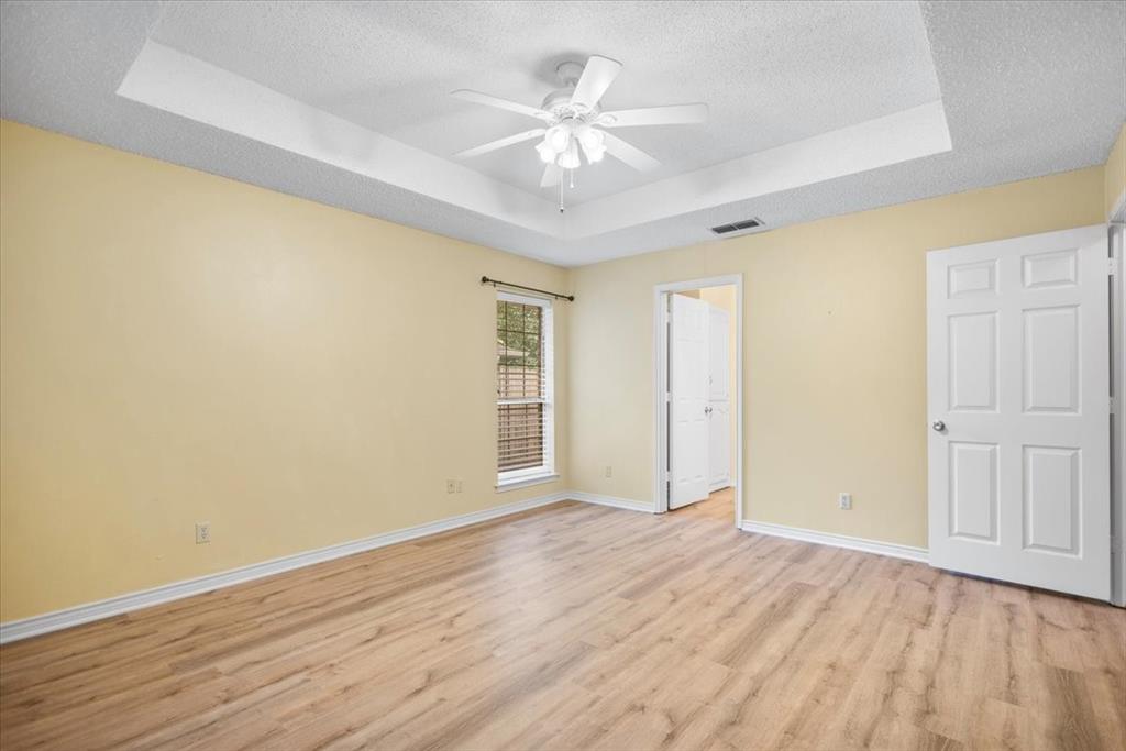 2824 Crestview Avenue Tyler, TX 75701 - Photo 23 of 39 wooden floor in an empty room with a window