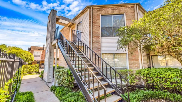 a view of a house with wooden stairs