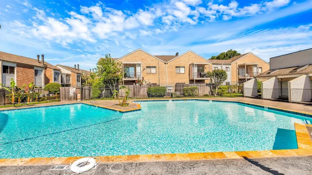 a view of swimming pool with lounge chair