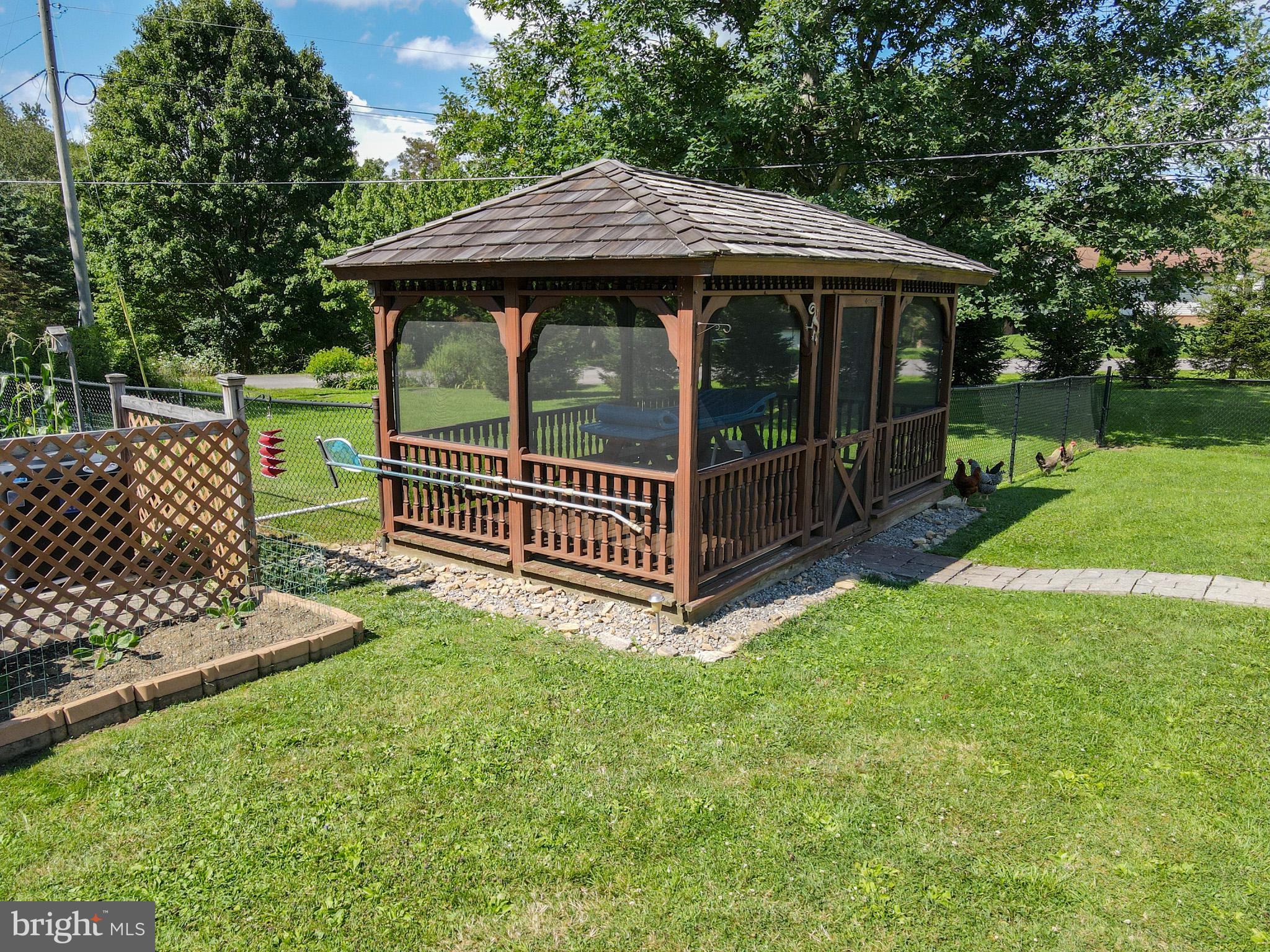 265 Fearer Road Friendsville, MD 21531 - Photo 62 of 75 Charming gazebo in a lush garden.