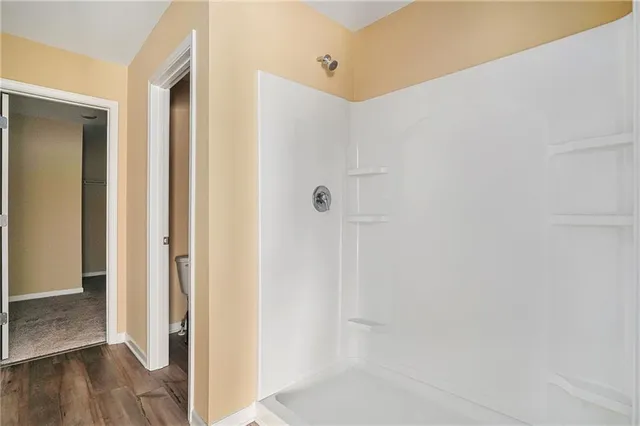 a view of a bathroom with wooden floor