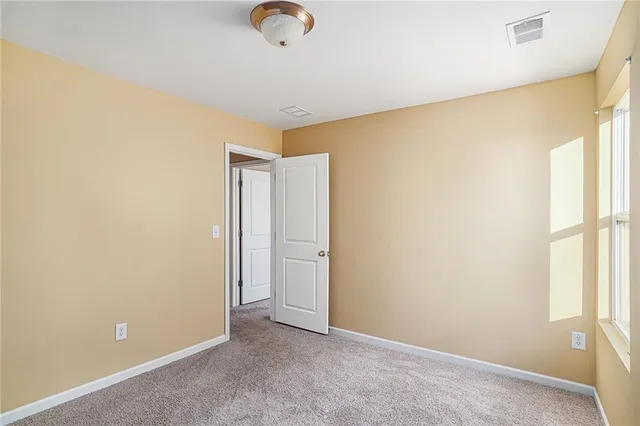 an empty room with a empty space and a window