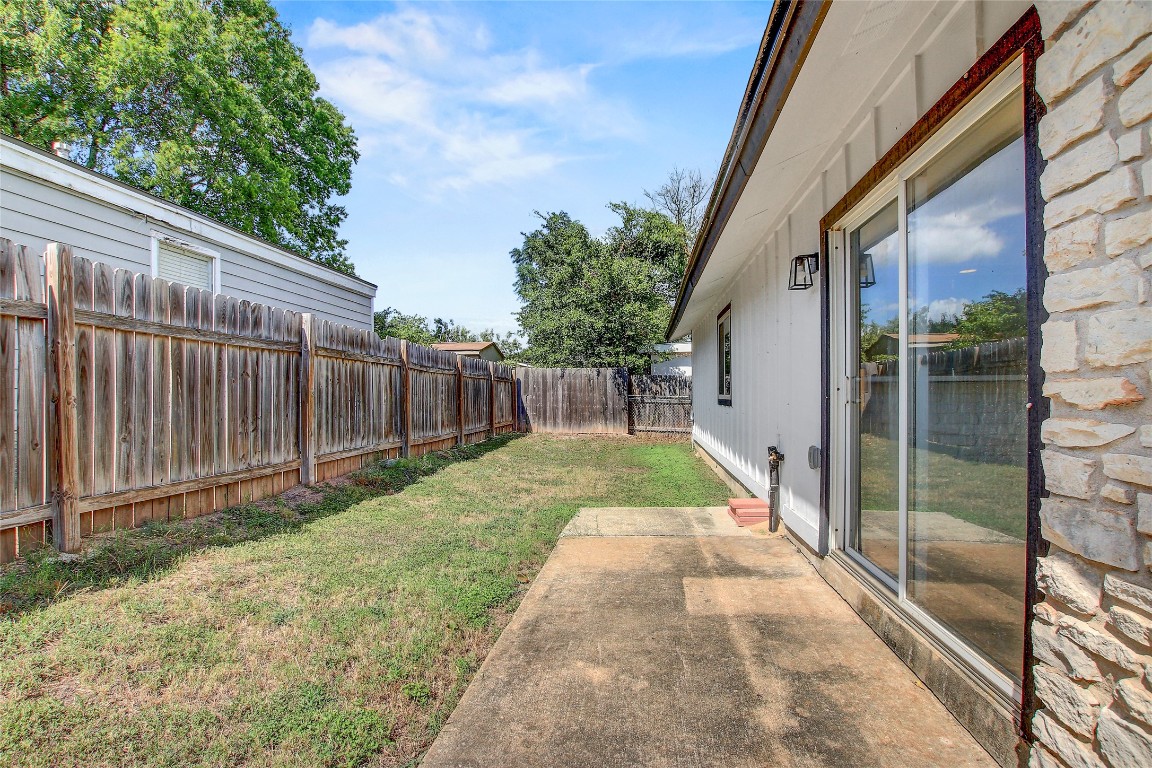 902 King Albert Street, Unit A Austin, TX 78745 - Photo 18 of 19 Fenced backyard featuring a patio area