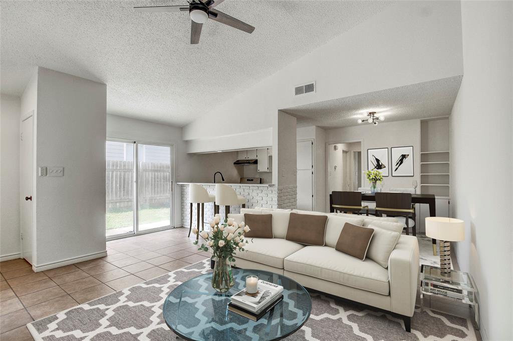 902 King Albert Street, Unit A Austin, TX 78745 - Photo 3 of 19 Living area with a textured ceiling, light tile patterned flooring, ceiling fan, and high vaulted ceiling
