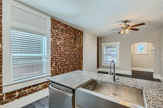 a kitchen with a sink and a window