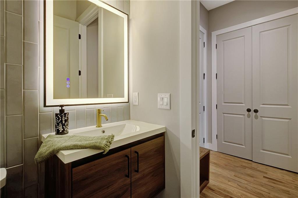 454 Connally Street Southeast Atlanta, GA 30312 - Photo 11 of 32 a bathroom with a sink and a mirror