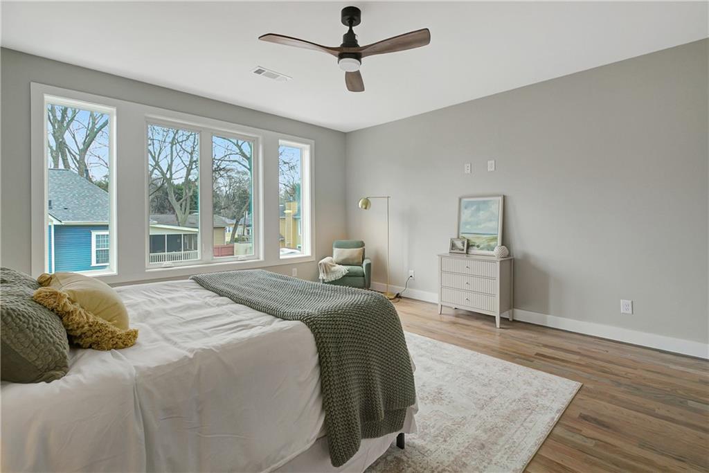 454 Connally Street Southeast Atlanta, GA 30312 - Photo 13 of 32 a bedroom with a large bed and a window