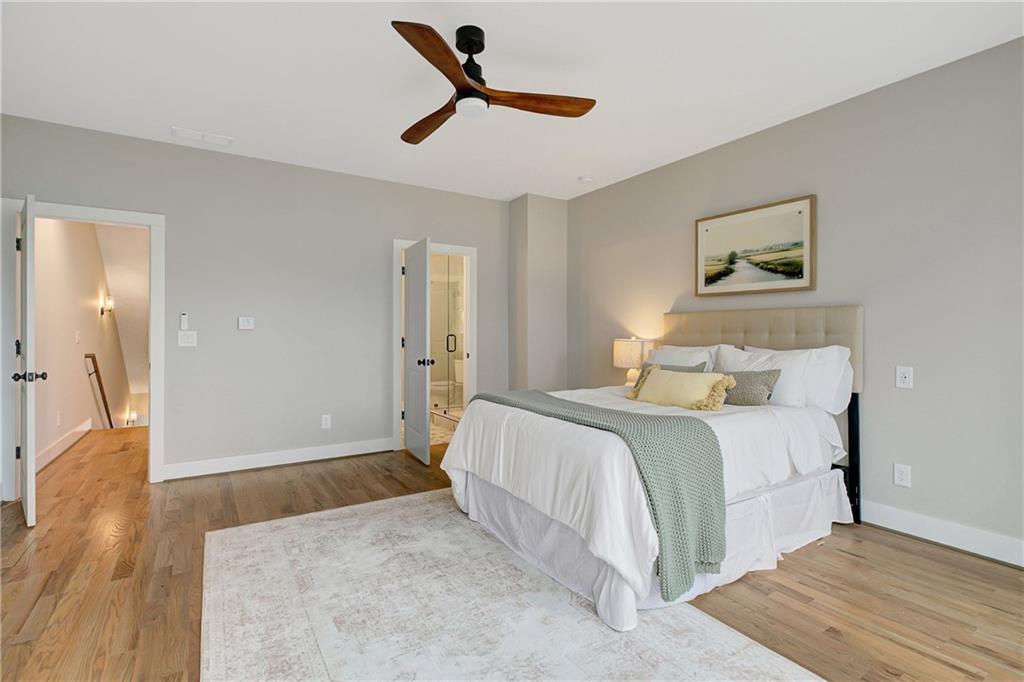 454 Connally Street Southeast Atlanta, GA 30312 - Photo 14 of 32 a bedroom with a bed and a painting on the wall