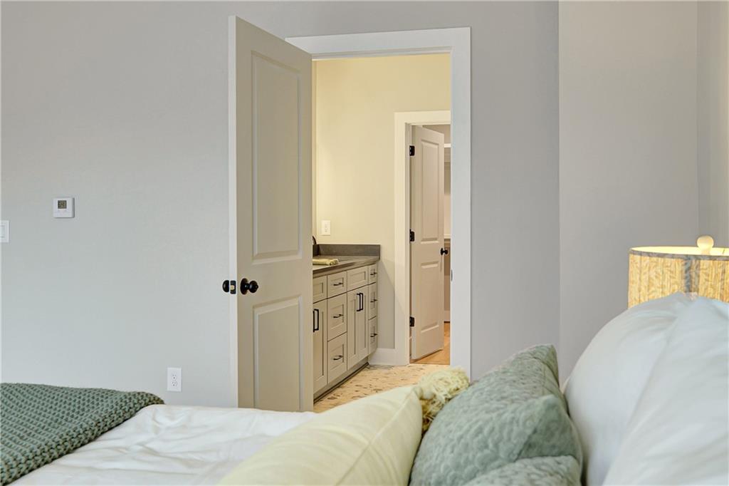 454 Connally Street Southeast Atlanta, GA 30312 - Photo 15 of 32 a bedroom with a bed and a closet