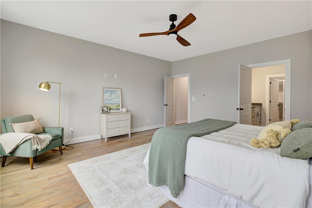 454 Connally Street Southeast Atlanta, GA 30312 - Photo 16 of 32 a bedroom with a bed and a couch