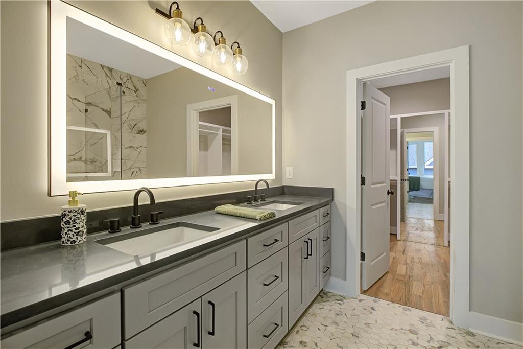 454 Connally Street Southeast Atlanta, GA 30312 - Photo 17 of 32 a spacious bathroom with double sink and a mirror
