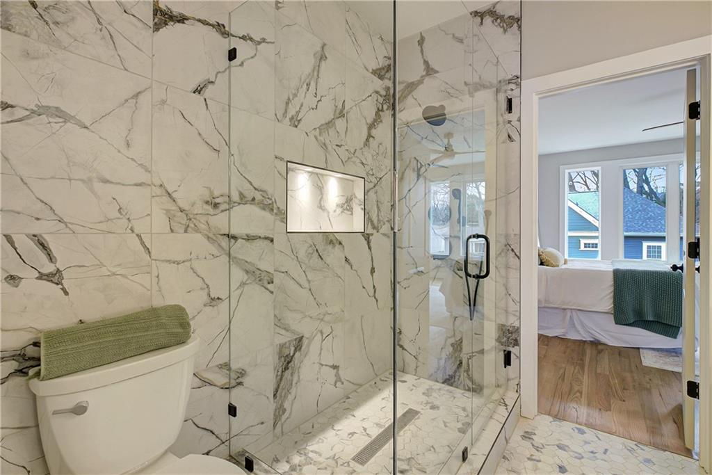 454 Connally Street Southeast Atlanta, GA 30312 - Photo 18 of 32 a bathroom with a shower and toilet