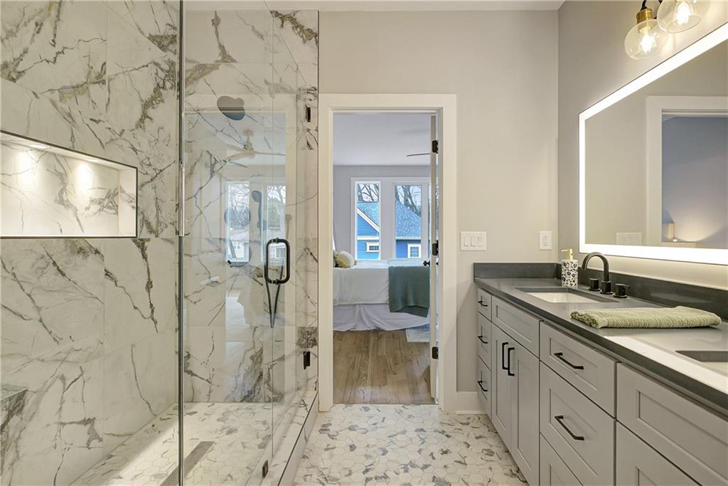 454 Connally Street Southeast Atlanta, GA 30312 - Photo 19 of 32 a spacious bathroom with double vanity and a shower