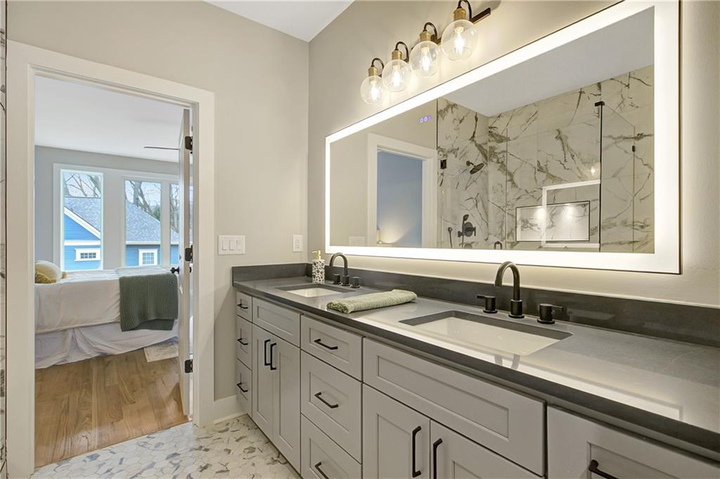 454 Connally Street Southeast Atlanta, GA 30312 - Photo 20 of 32 a bathroom with a granite countertop sink mirror and double