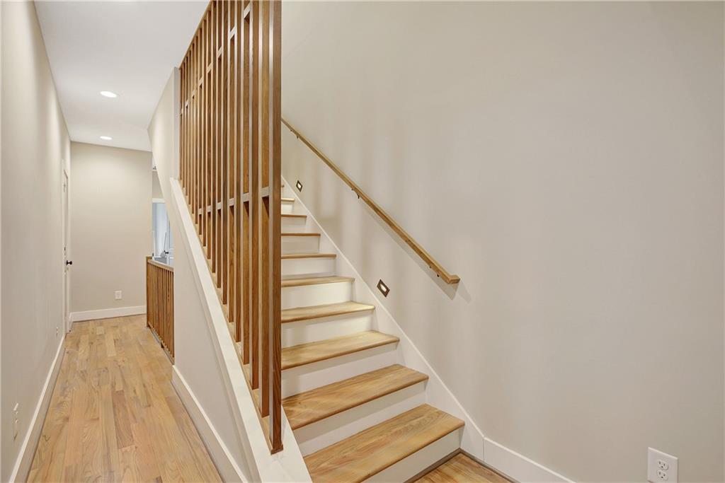 454 Connally Street Southeast Atlanta, GA 30312 - Photo 24 of 32 a view of staircase with wooden floor and white walls