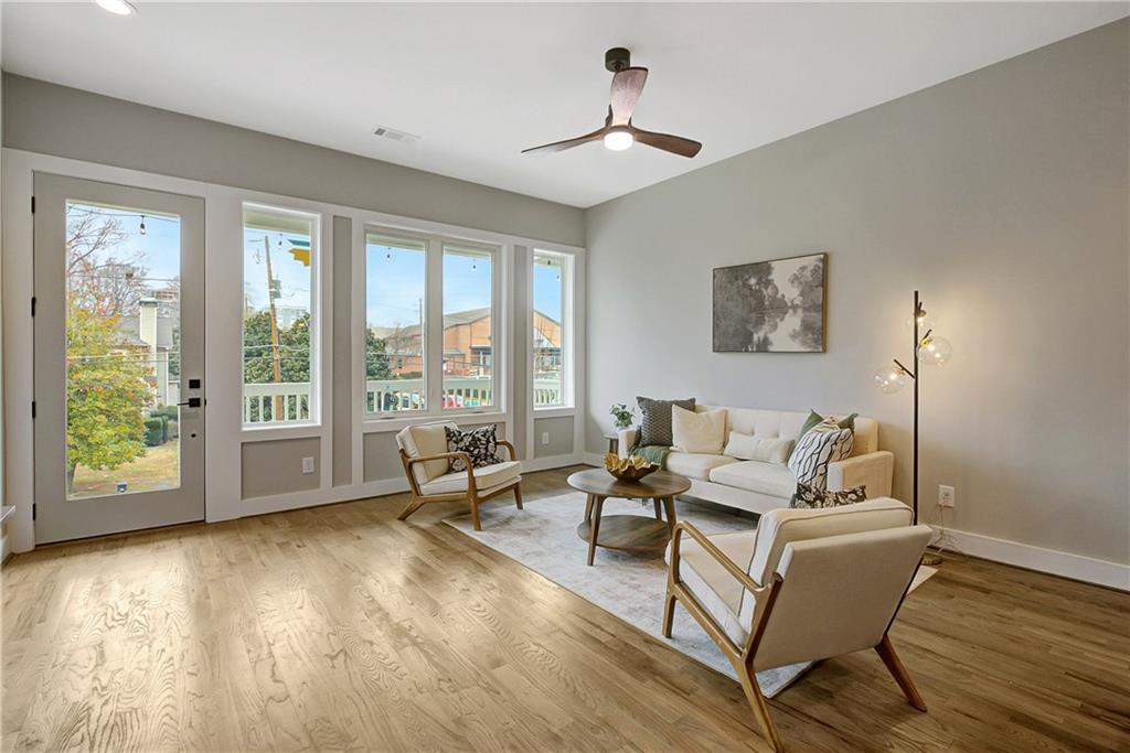 454 Connally Street Southeast Atlanta, GA 30312 - Photo 5 of 32 a living room with furniture and large windows