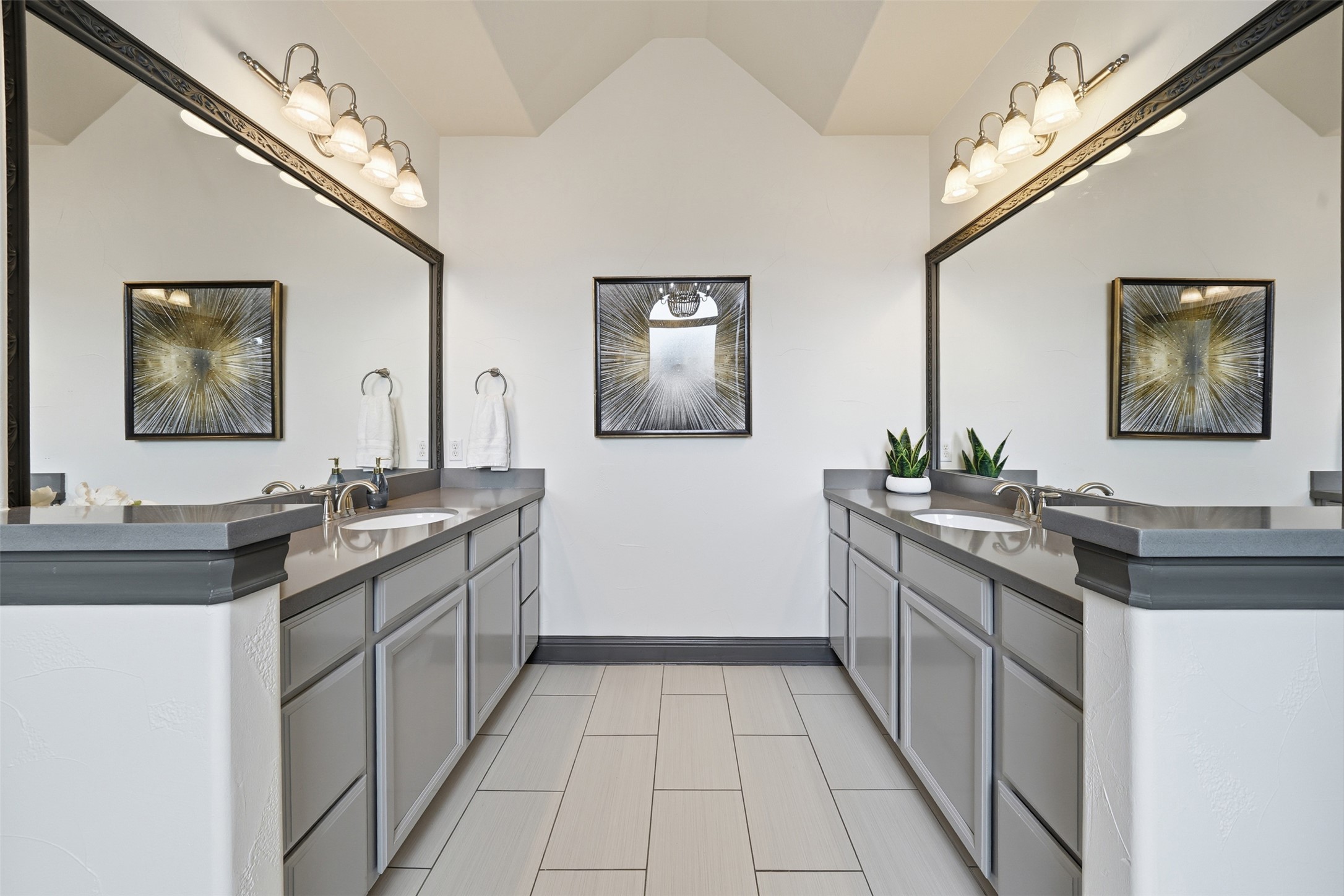 8729 Vantage Point Drive Austin, TX 78737 - Photo 29 of 33 Twin vanities with individual sinks and contemporary lighting fixtures highlight this primary bathroom's spacious design.