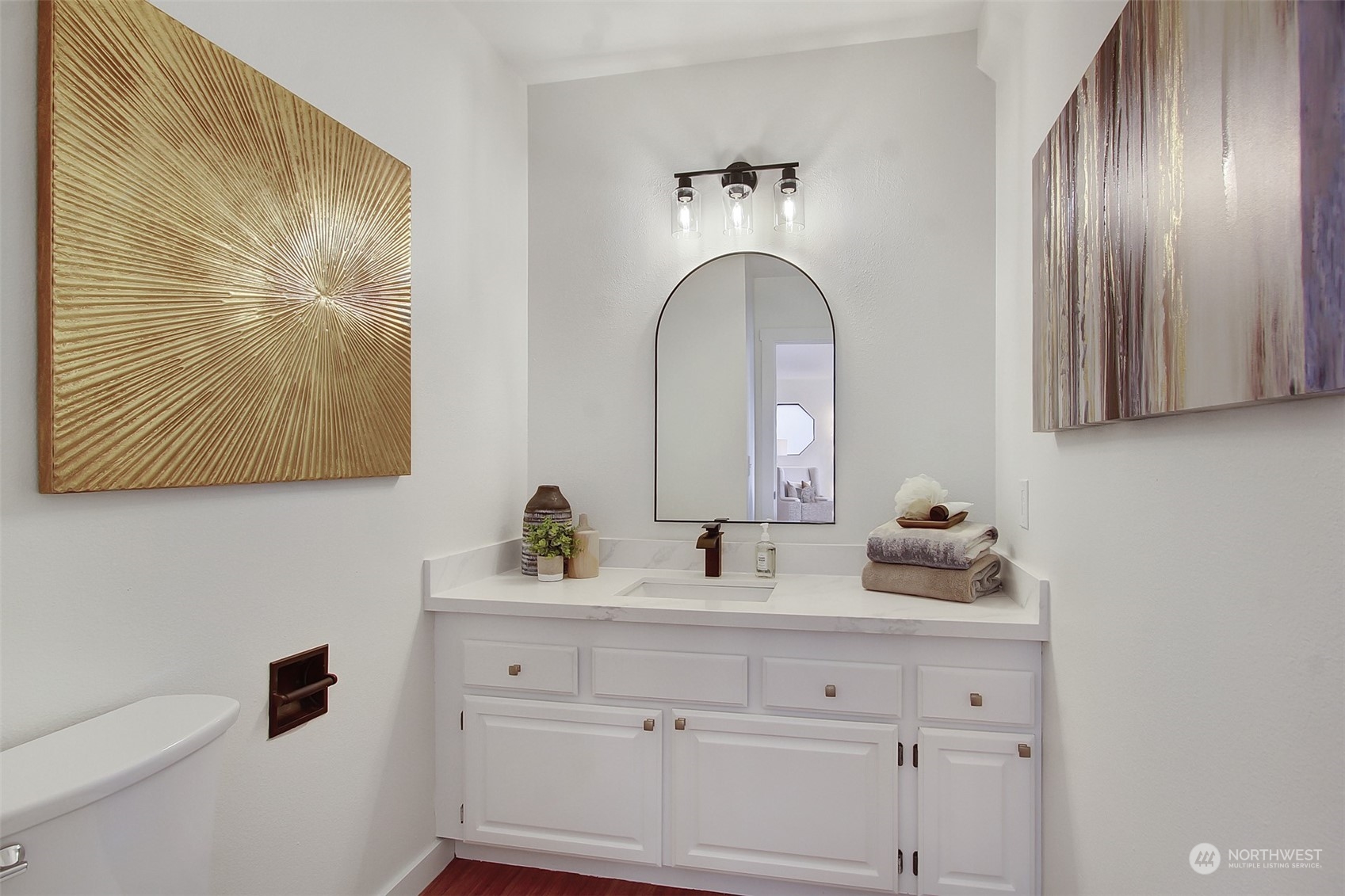 323 Northeast 76th Street Seattle, WA 98115 - Photo 17 of 33 a bathroom with a sink and mirror