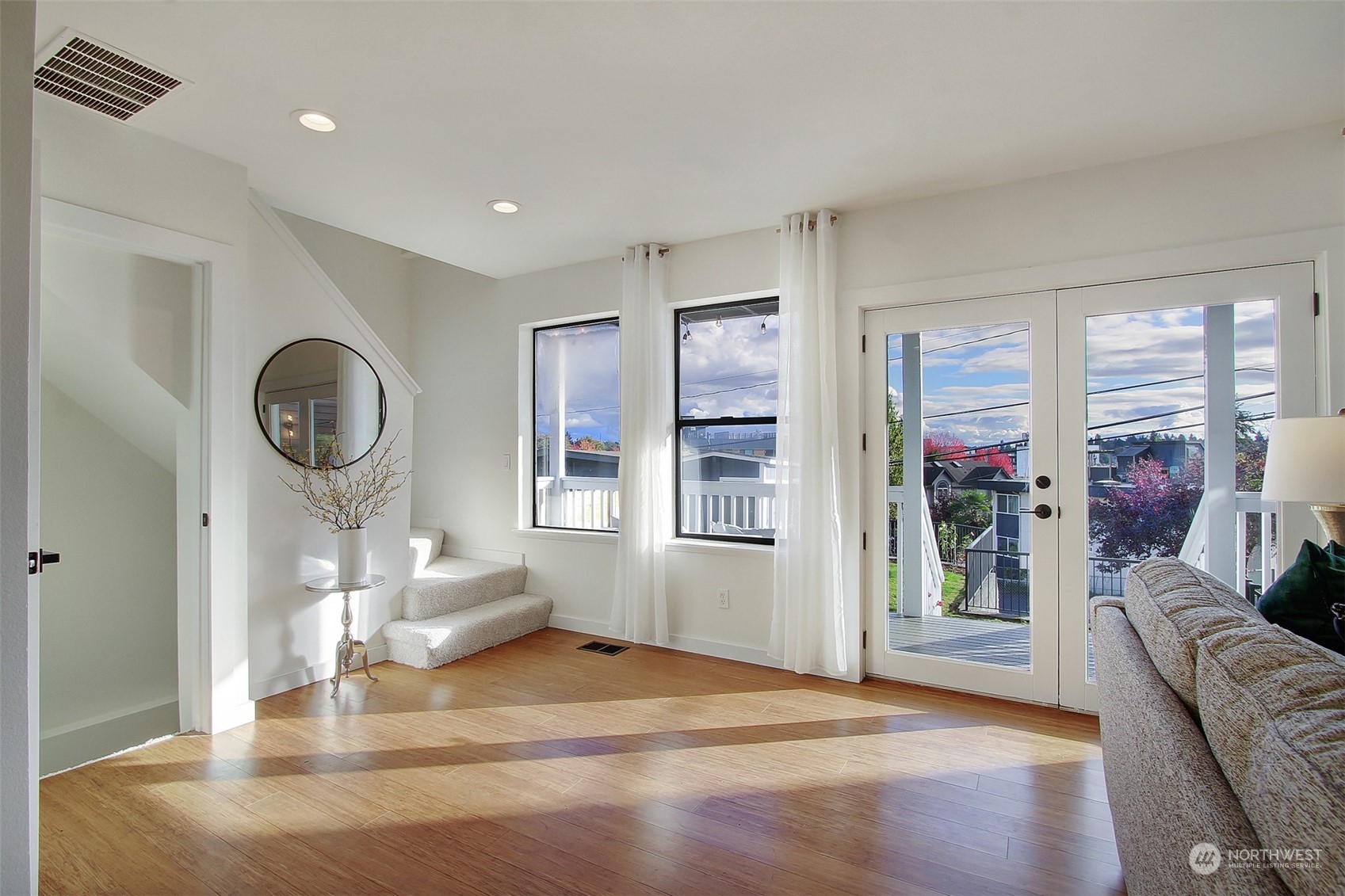 323 Northeast 76th Street Seattle, WA 98115 - Photo 18 of 33 a living room with furniture a window and a chandelier
