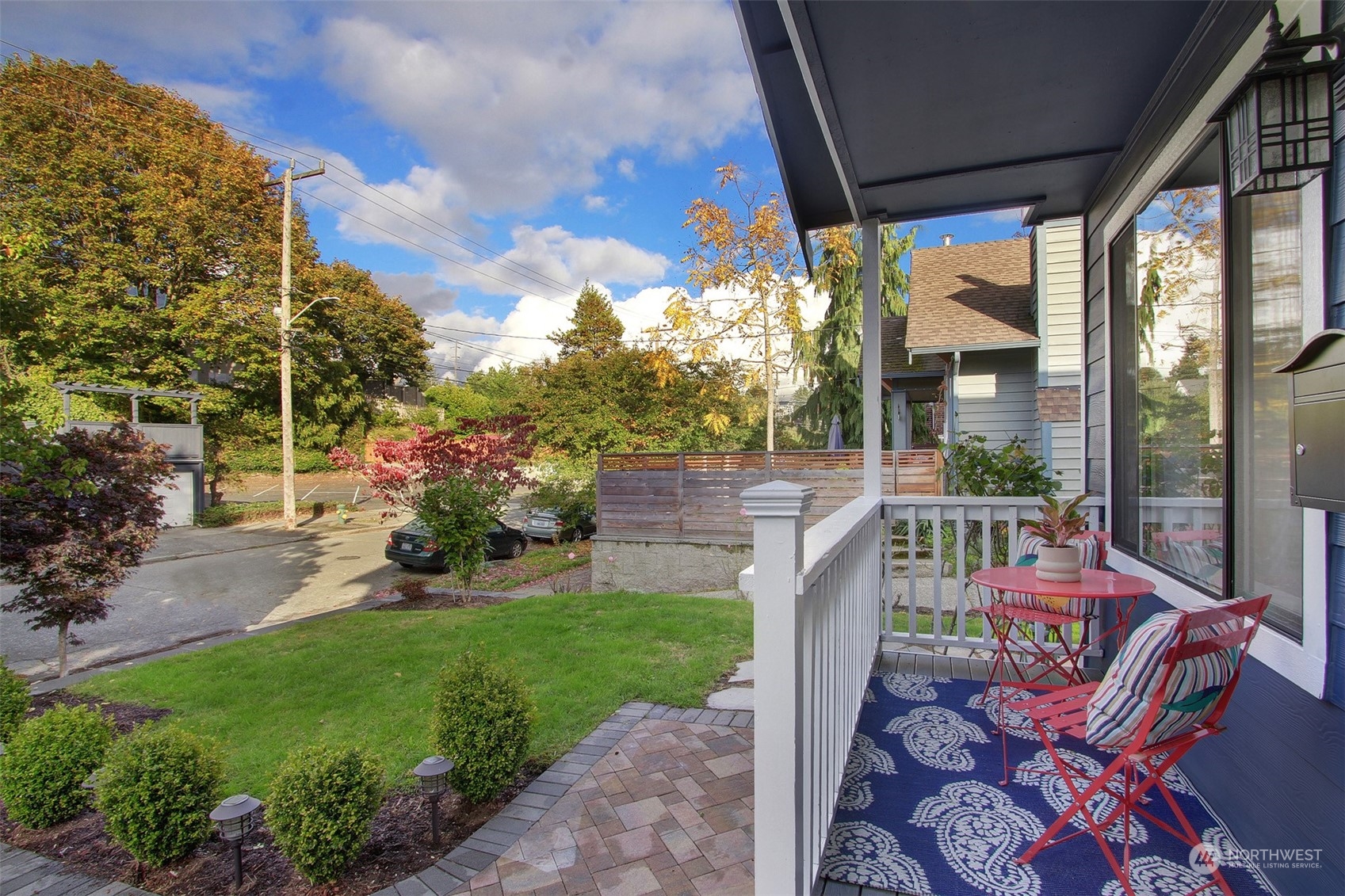 323 Northeast 76th Street Seattle, WA 98115 - Photo 2 of 33 a view of a patio with couches table and chairs and potted plants