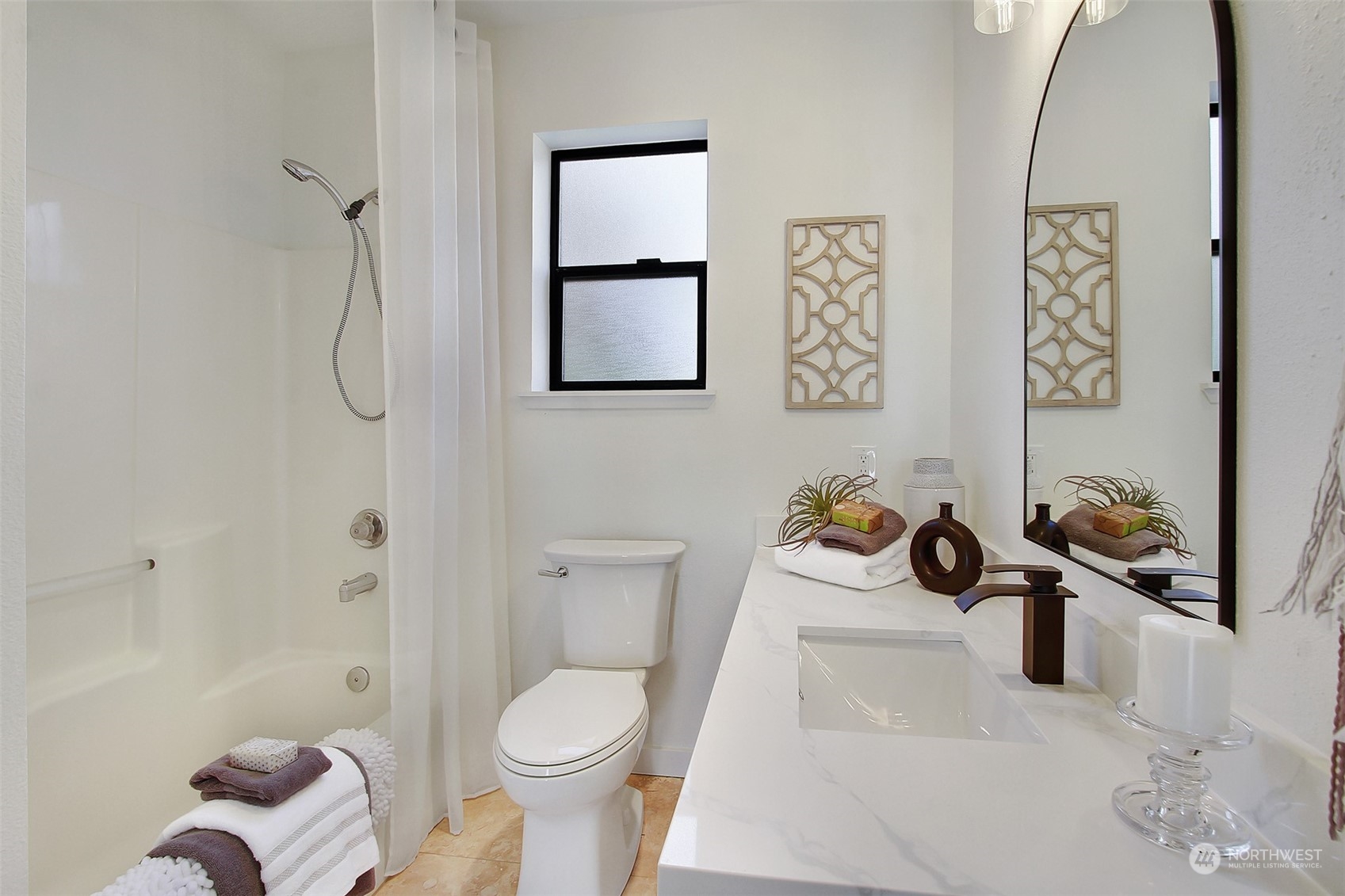 323 Northeast 76th Street Seattle, WA 98115 - Photo 27 of 33 a bathroom with a toilet and a shower