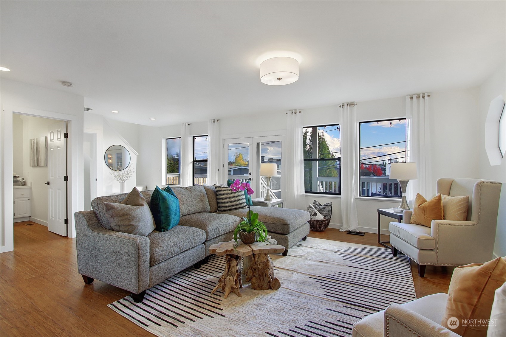 323 Northeast 76th Street Seattle, WA 98115 - Photo 4 of 33 a living room with furniture and a large window