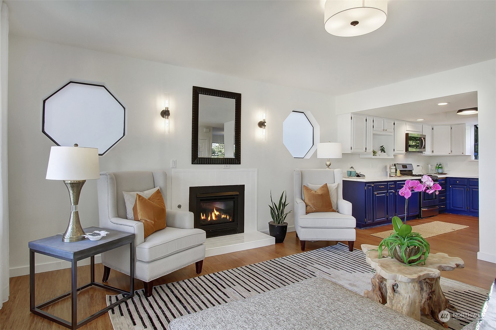 323 Northeast 76th Street Seattle, WA 98115 - Photo 6 of 33 a living room with furniture and a fireplace