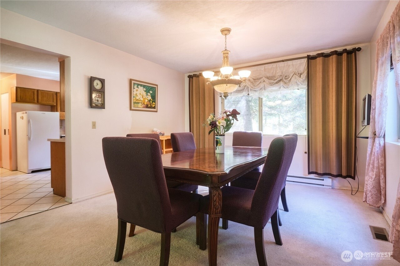 1857 Washington Drive Point Roberts, WA 98281 - Photo 16 of 38 a view of a dining room with furniture window and wooden floor