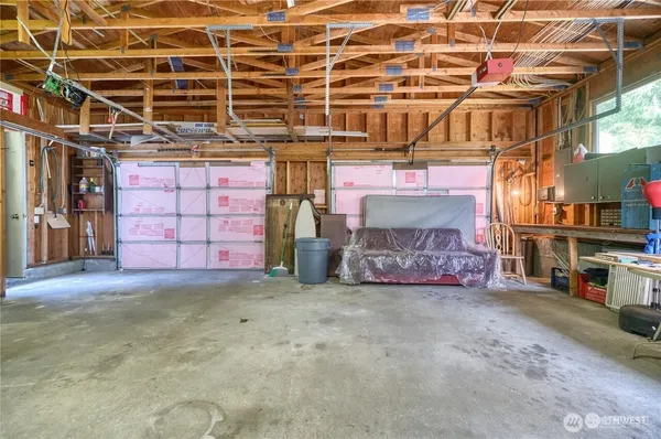 a view of a room with wooden walls