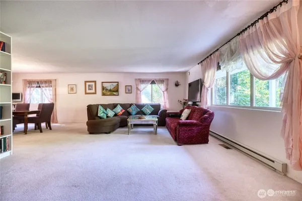 a living room with furniture and a window