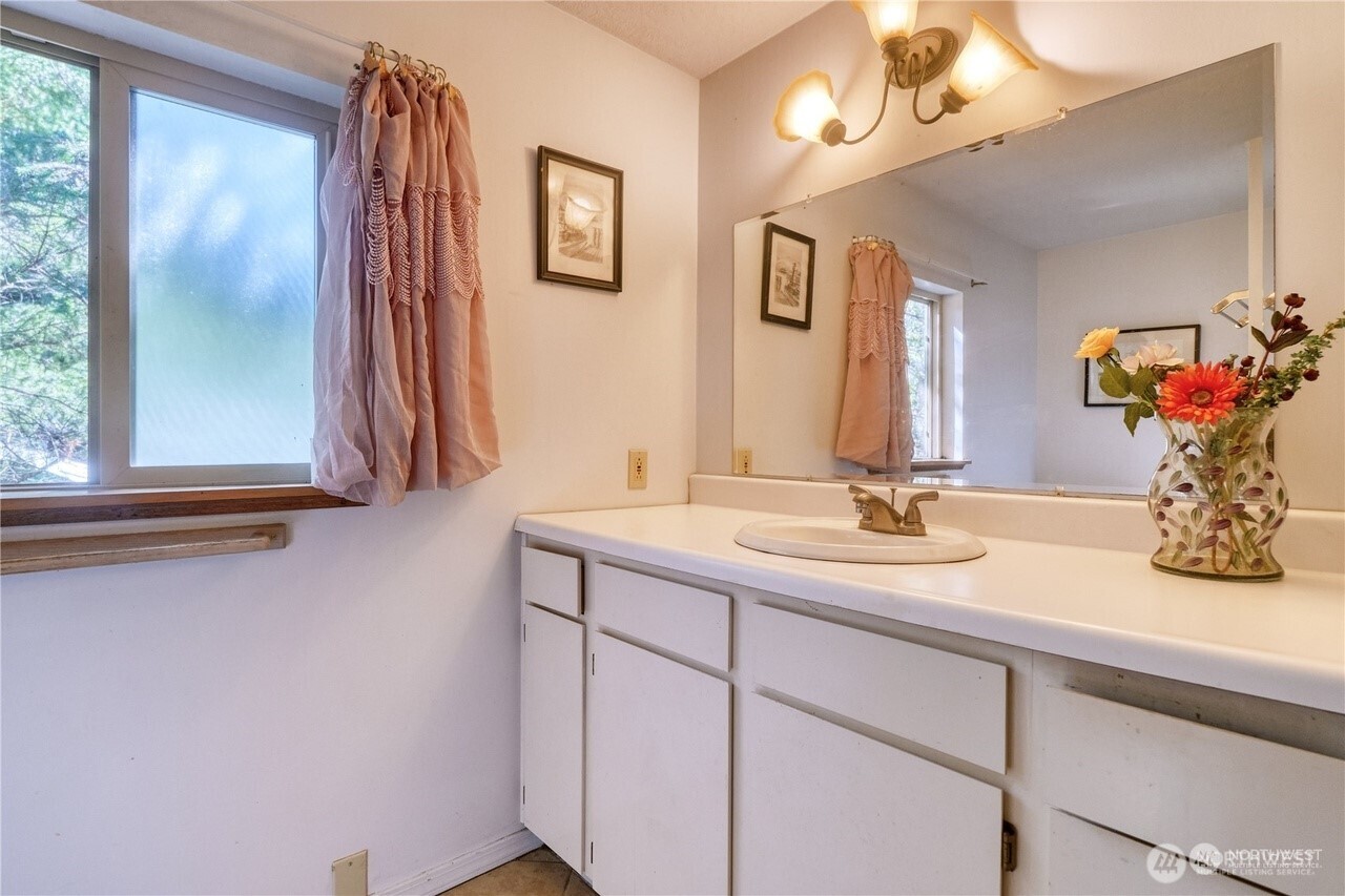 1857 Washington Drive Point Roberts, WA 98281 - Photo 10 of 38 a bathroom with a sink and a mirror