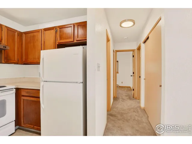 a white refrigerator freezer sitting inside of a kitchen