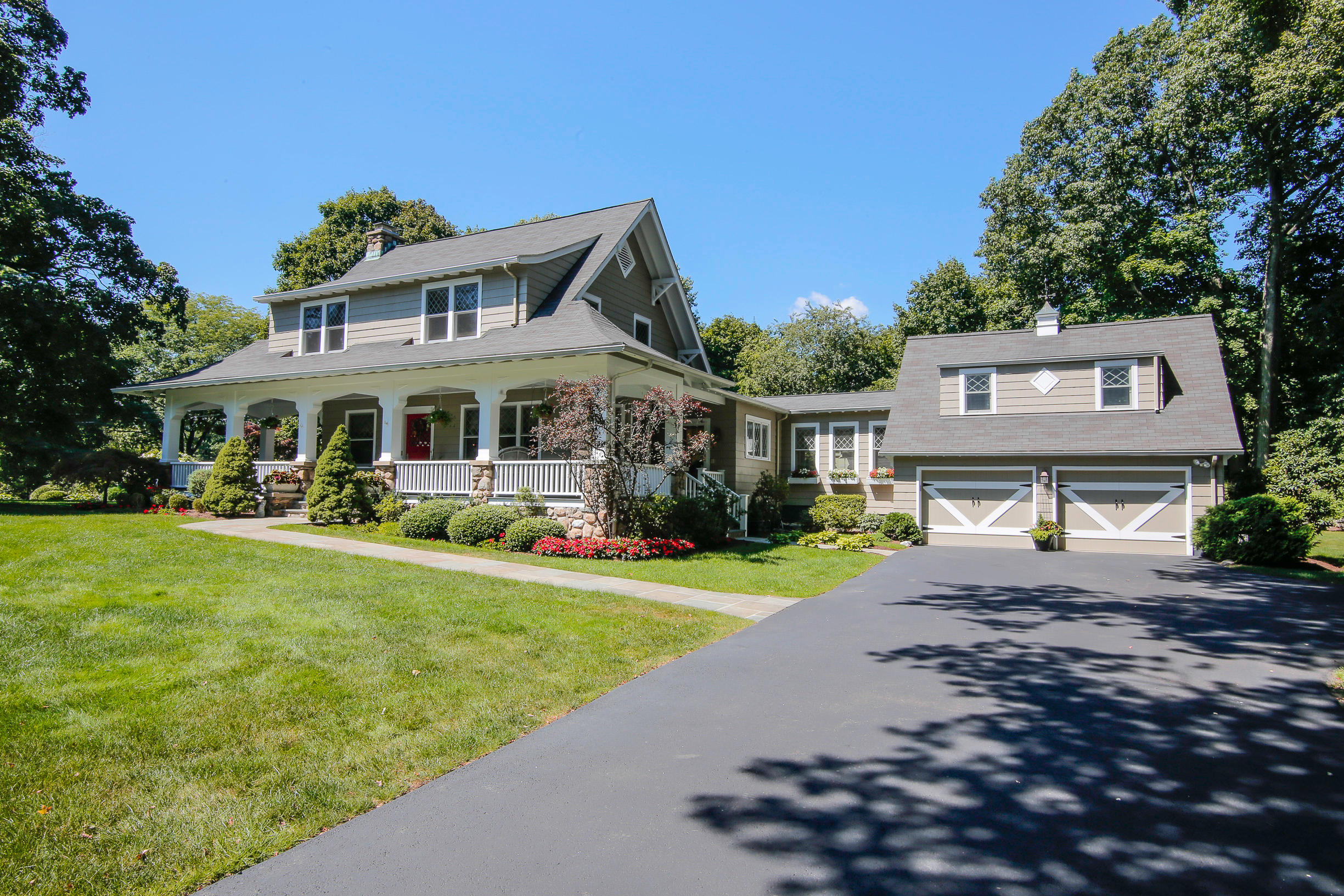 a front view of a house with a yard table and chairs