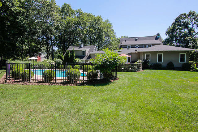 21 Old Studio Road New Canaan, CT 06840 - Photo 16 of 39 a view of a house with a yard and sitting area