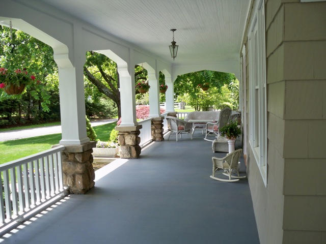 21 Old Studio Road New Canaan, CT 06840 - Photo 2 of 39 a view of a porch with chairs and backyard
