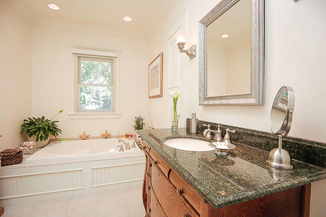21 Old Studio Road New Canaan, CT 06840 - Photo 27 of 39 a bathroom with a granite countertop sink and a mirror