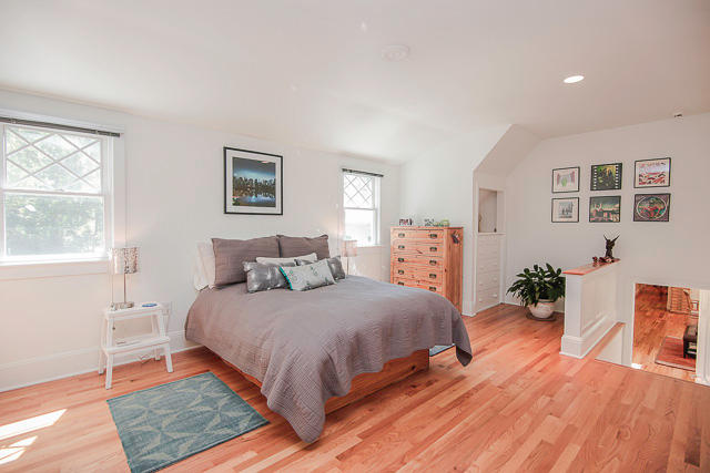 21 Old Studio Road New Canaan, CT 06840 - Photo 29 of 39 a bedroom with a large bed and a wooden floor