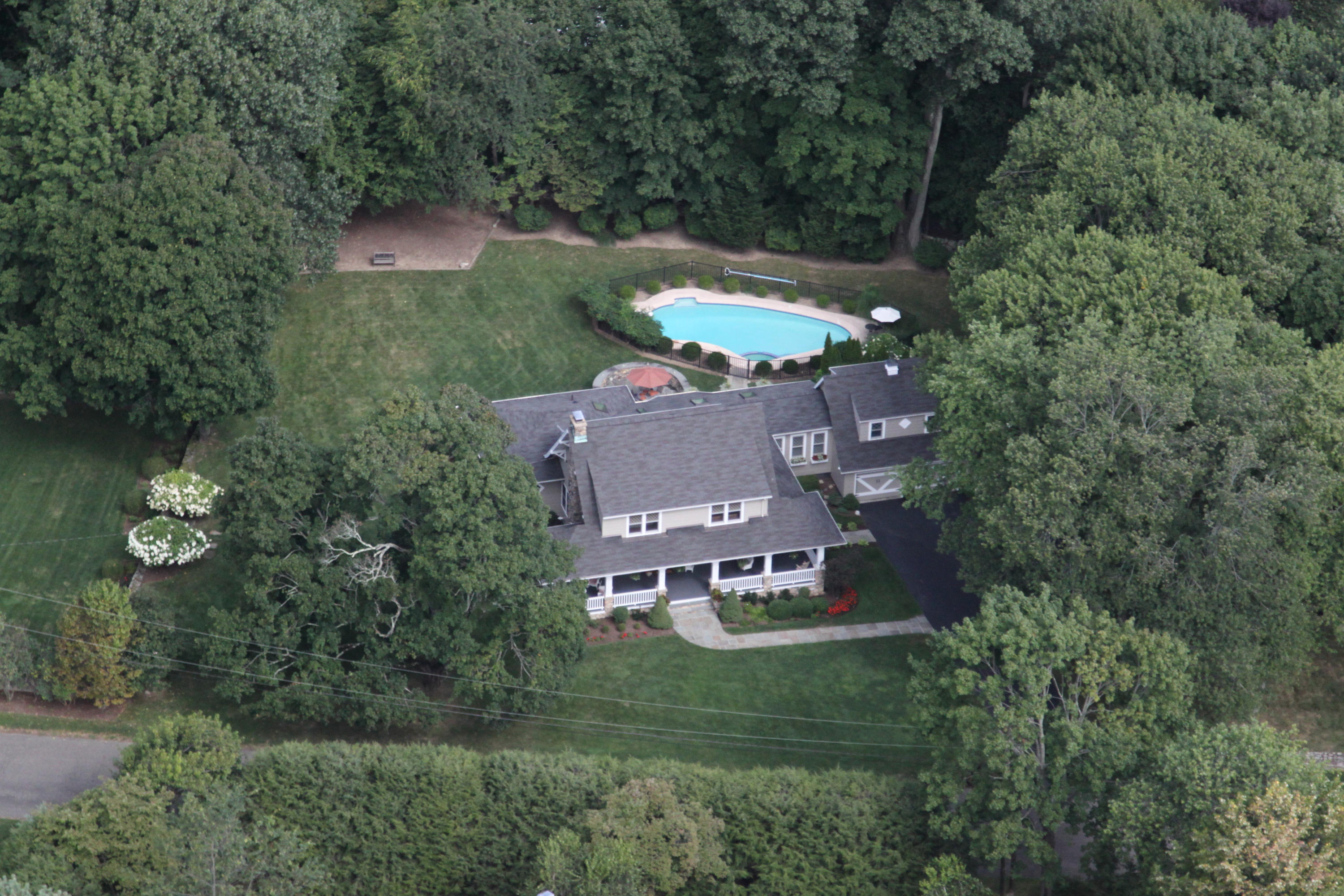 21 Old Studio Road New Canaan, CT 06840 - Photo 3 of 39 an aerial view of a house with outdoor space swimming pool and mountain view