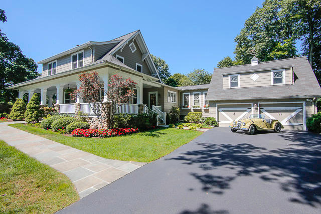 21 Old Studio Road New Canaan, CT 06840 - Photo 33 of 39 a front view of a house with a garden and porch