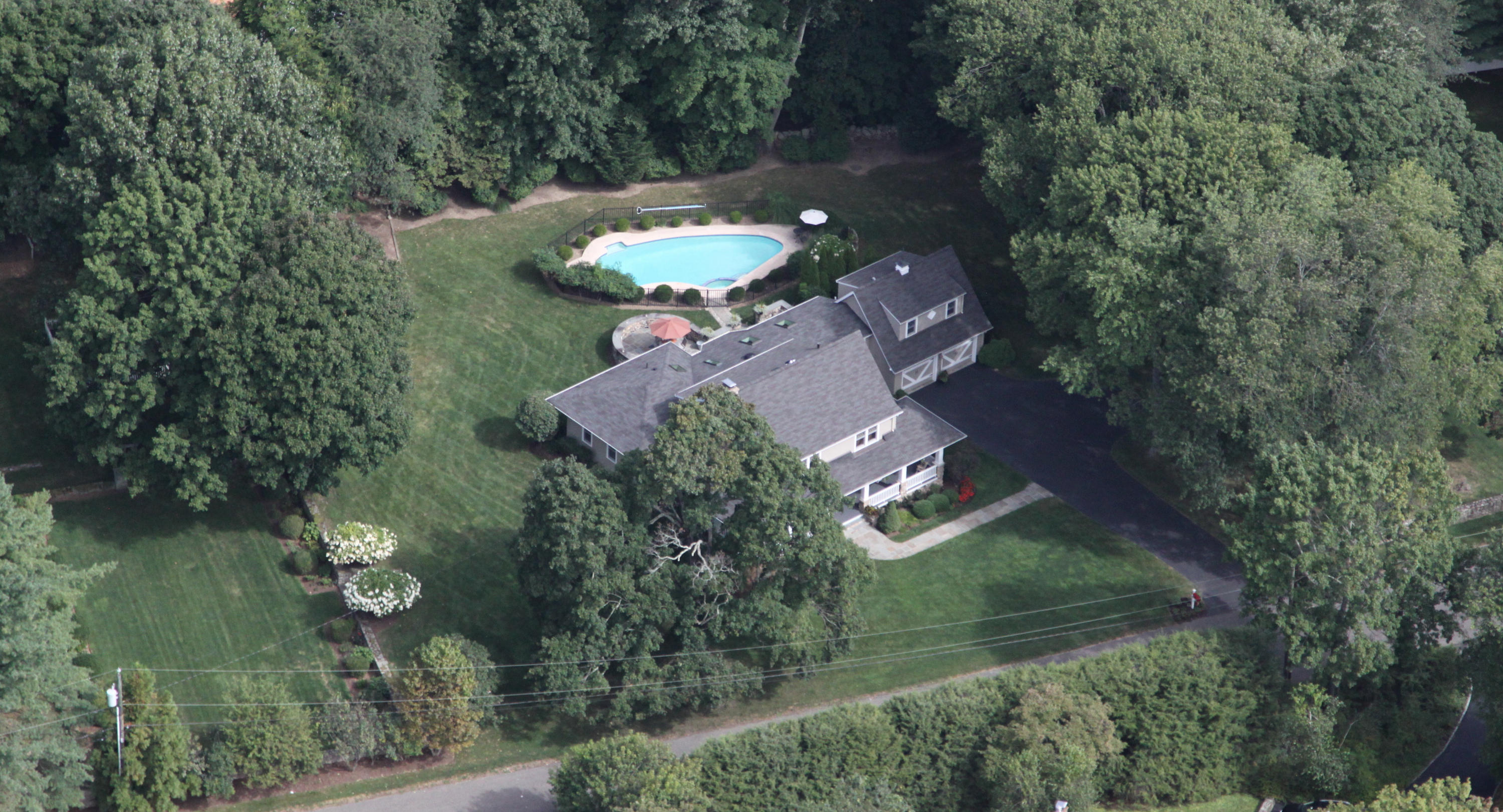 21 Old Studio Road New Canaan, CT 06840 - Photo 34 of 39 an aerial view of a house with a yard