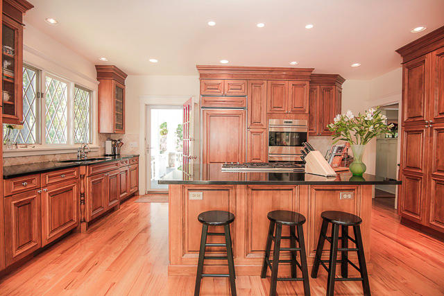 21 Old Studio Road New Canaan, CT 06840 - Photo 8 of 39 a kitchen with granite countertop wooden cabinets and stainless steel appliances